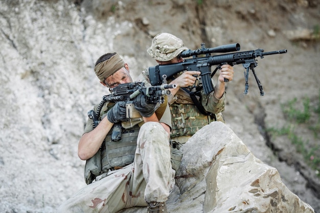 Army sniper during the military operation in the mountain war
army technology and people concept