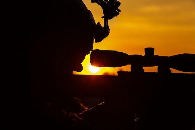 Army sniper on sunset