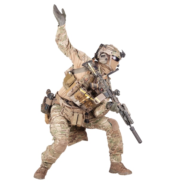 Army soldier, modern combatant, fireteam sergeant in battle uniform and helmet, armed with service rifle, duck under enemy fire, giving follow me arm signal studio shoot isolated on white background