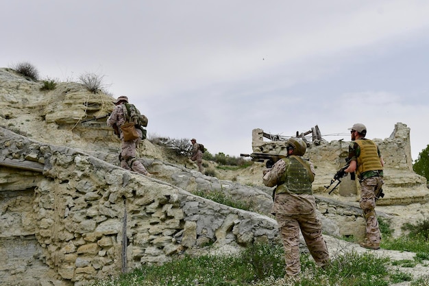 Army soldier performing military maneuvers on the battlefield