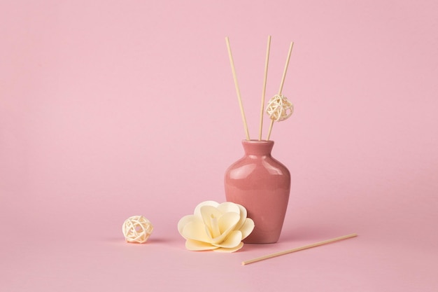 Aromatherapy accessories on a light pink background