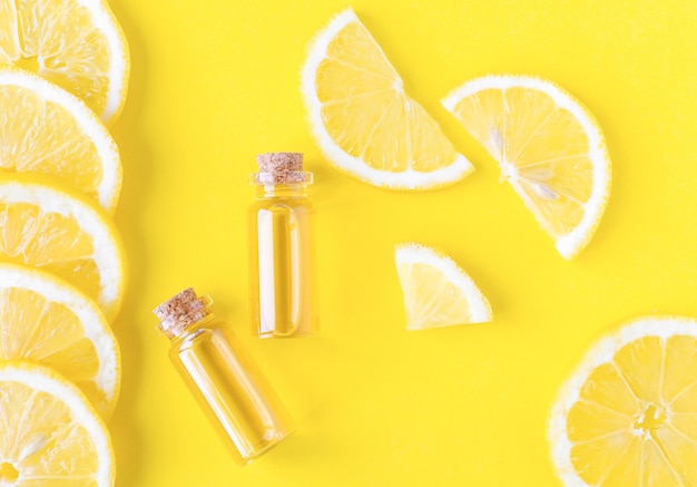 aromatherapy citrus oil on a yellow background lemon slices and essential oil