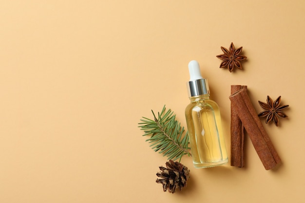 Aromatherapy concept with pine oil on beige background