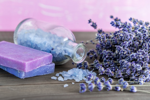 Aromatherapy oil and lavender spa, wellness with lavender, salt on a wooden background