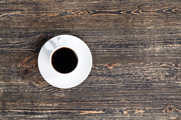 Aromatic coffee in a white Cup during a meal