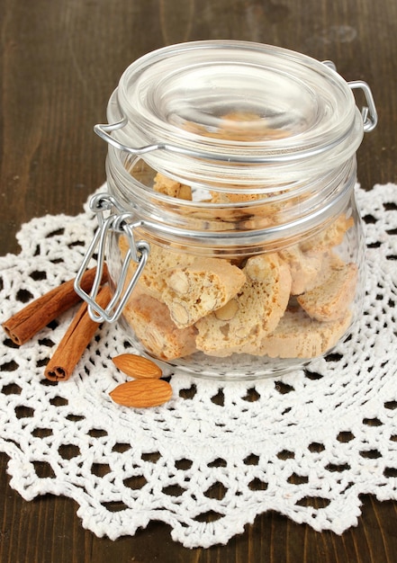 Aromatic cookies cantuccini on bank on wooden table closeup