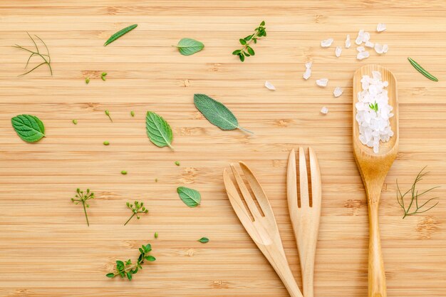 Aromatic herbs and spices  on wooden background .