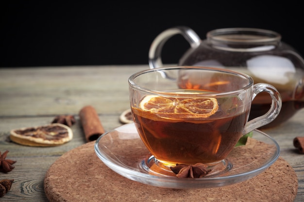 Aromatic hot cinnamon tea on wooden table