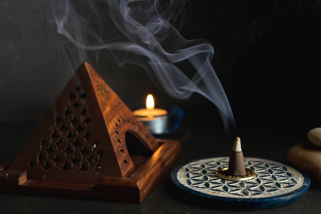 Photo aromatic incense burning on an incense burner