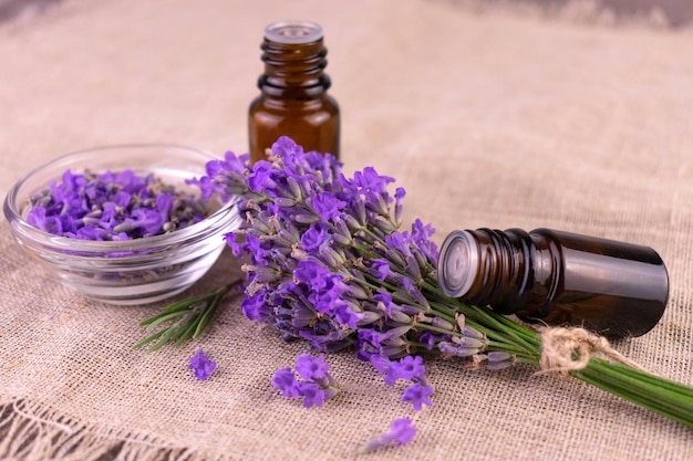 Aromatic lavender oil. And a bouquet of lavender flowers.