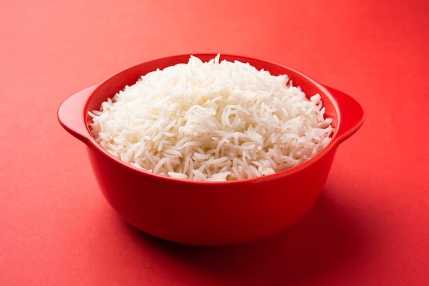 Aromatic Long Basmati cooked plain Rice is an Indian main course food, served in a bowl. selective focus