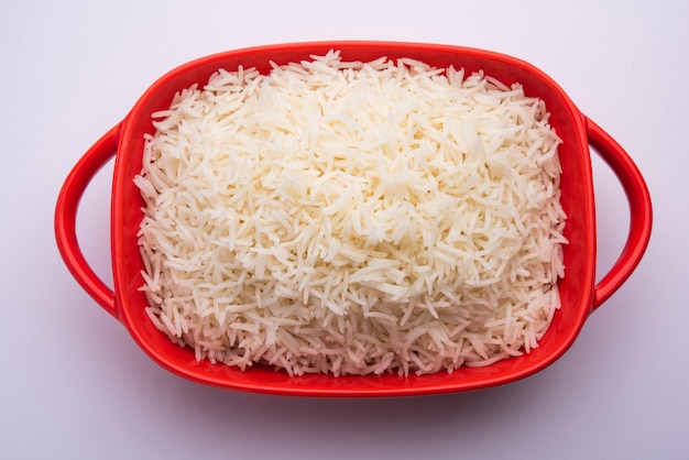 Aromatic Long Basmati cooked plain Rice is an Indian main course food, served in a bowl. selective focus