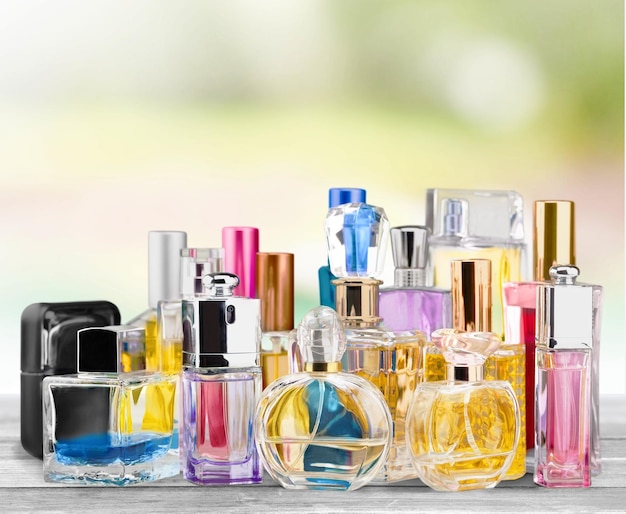 Photo aromatic perfume bottles on bright background