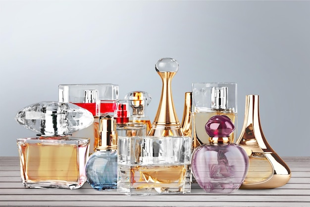 Photo aromatic perfume bottles on light background