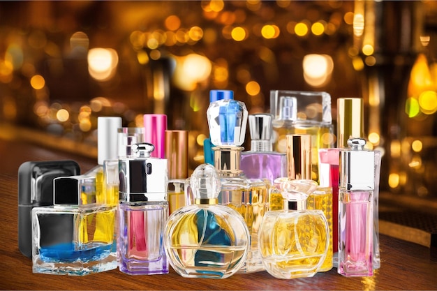 Photo aromatic perfume bottles on light background