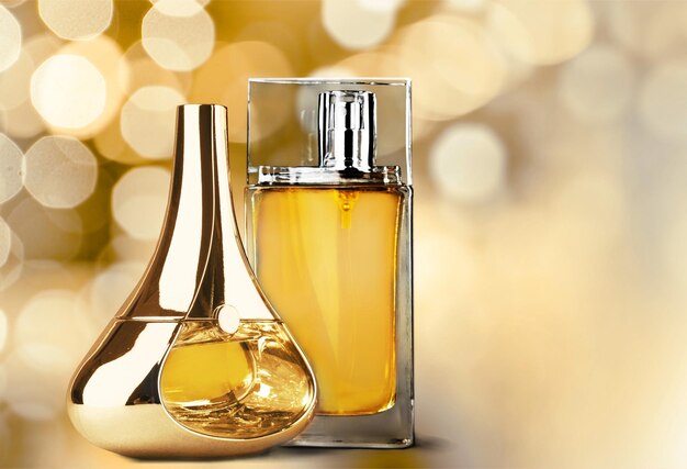 Aromatic Perfume bottles on shiny background