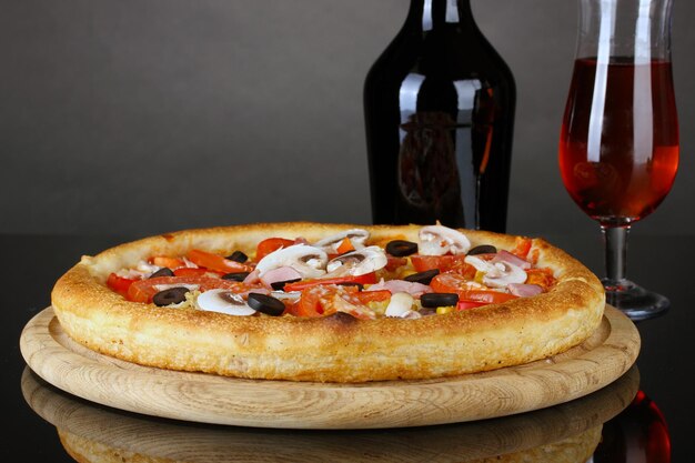 Aromatic pizza and wine isolated on black