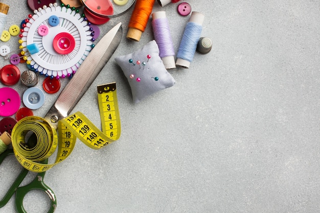 Arrangement of colourful accessories for sewing top view