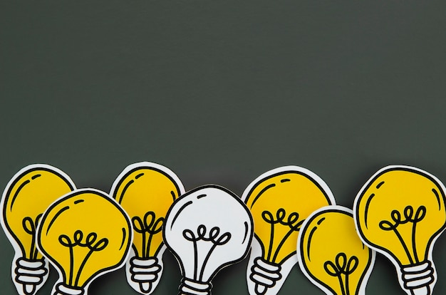 arrangement of light bulb idea concept on black background