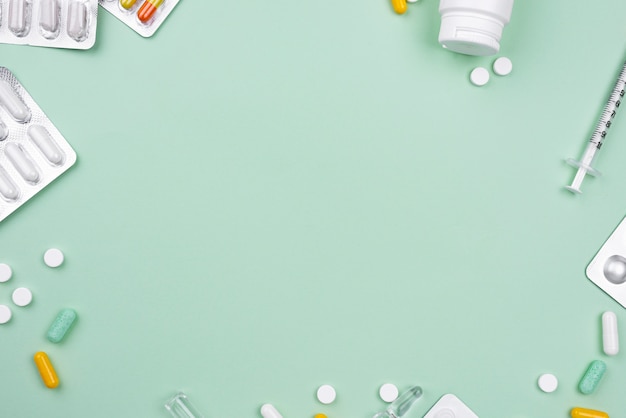 Photo arrangement of medical objects on green background with copy space