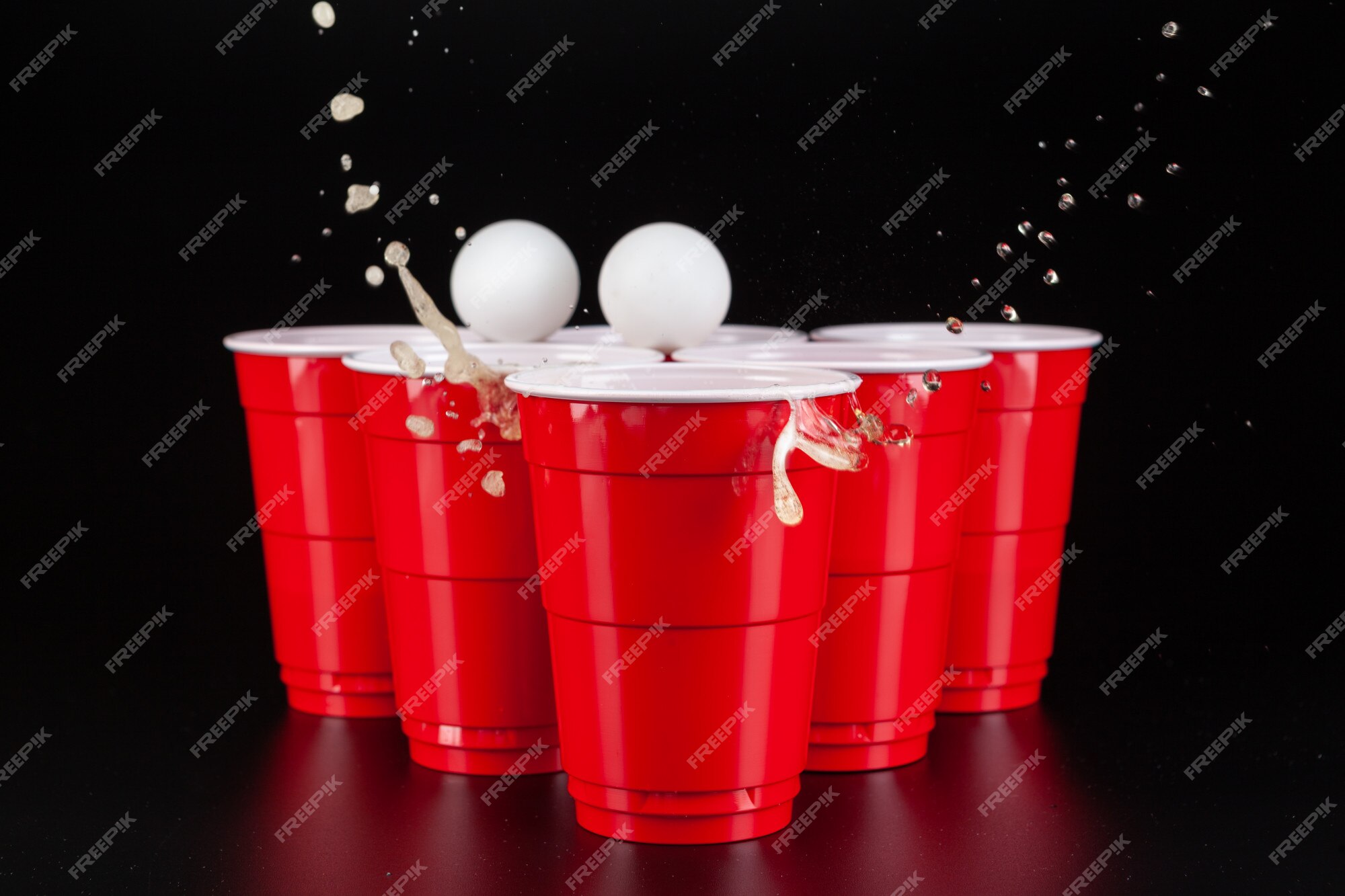 The arrangement of red plastic cups for game of beer pong Stock