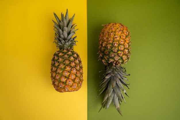 Photo arrangement of ripe pineapples in studio