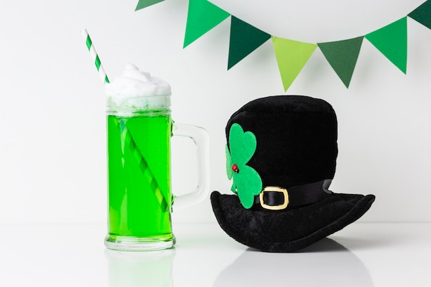 Photo arrangement with beverage and hat