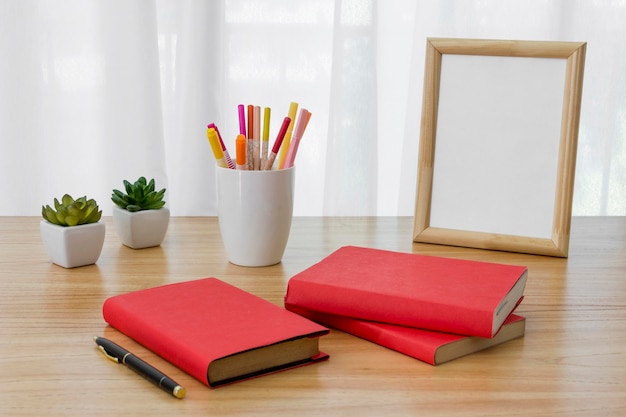 Photo arrangement with books on desk