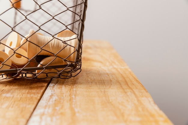 Photo arrangement with thread and wooden table