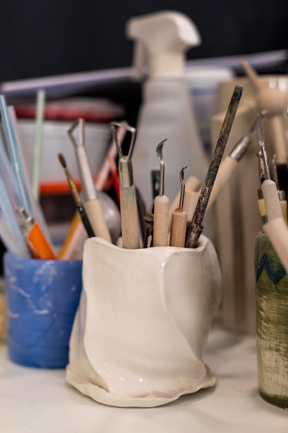 Photo arrangement with tools for pottery