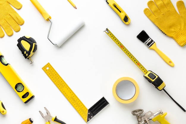 Photo arrangement of yellow repair tools flat lay