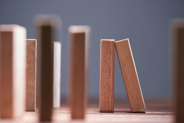 Arranging of wood blocks against gray background