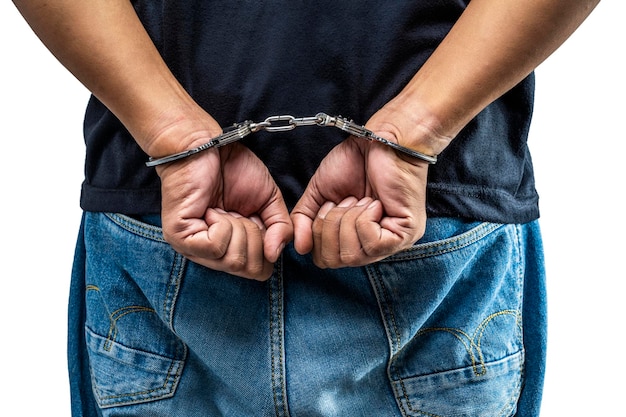 Arrested man with a handcuff on his hand isolated over a white background