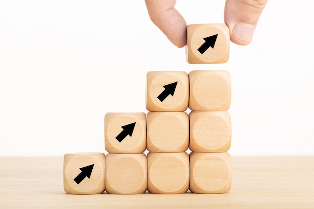 Arrow icon on wooden blocks