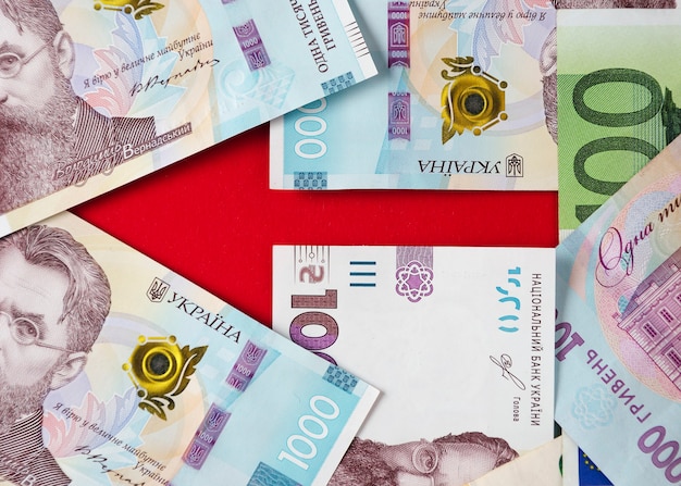 An arrow lined with banknotes of Ukrainian hryvnias and euros 5