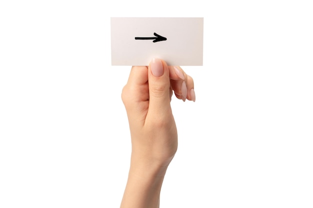 Arrow sign on a card in a woman hand isolated on a white background