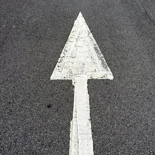 Photo arrow sign on road