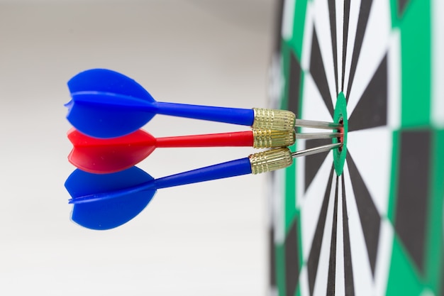 Arrows hitting the center of a target board