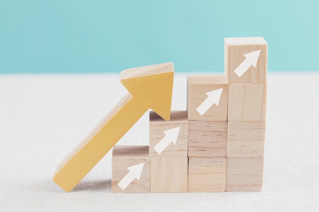 Arrows ladder up on wooden blocks