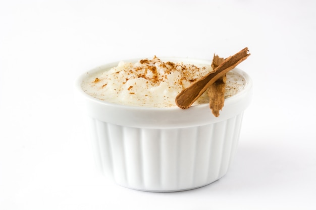 Arroz con leche. Rice pudding with cinnamon on white