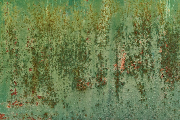 Art abstract grunge green paint background in shades of green and old gold colors