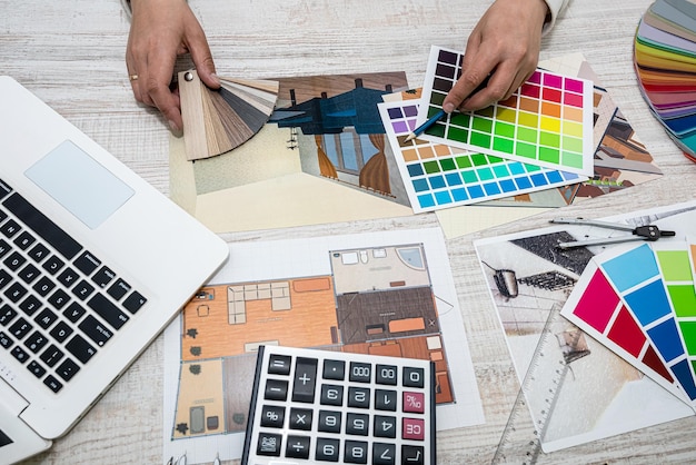 Art designer man chooses colors for office work