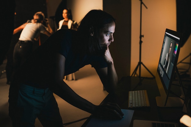 Art director checking photos on a monitor