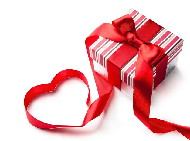 Photo art gift box with red ribbon in heart shape isolated on white background