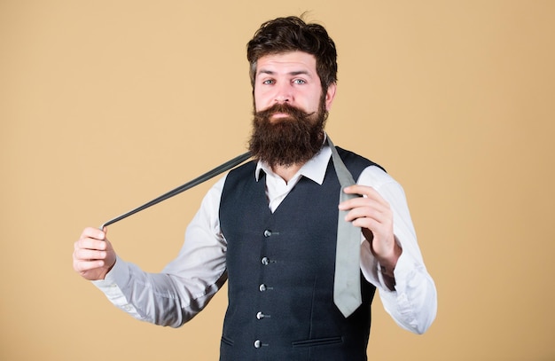 Art of manliness Man bearded hipster try to make knot Different ways of tying necktie knots How to tie necktie How to tie simple knot Start with your collar up and the tie around your neck