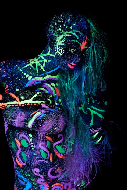 Girl with body painted with neon paint art