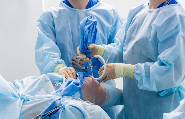 Arthroscope surgery. Orthopedic surgeons in teamwork in the operating room