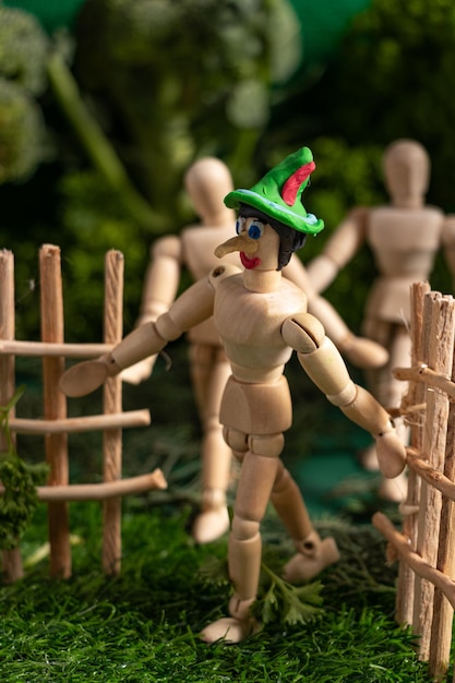 Articulated wooden dolls that simulate walking in a miniature world