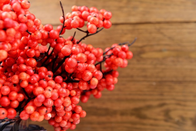 Artificial berries, on wooden table