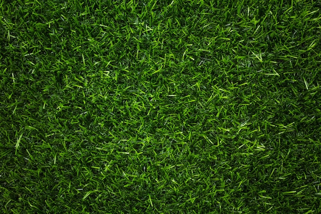 Photo artificial green grass texture for background